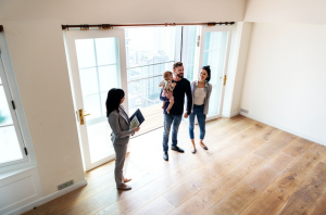 family looking at empty home